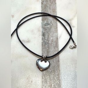 Sterling silver heart on rubber cord necklace.